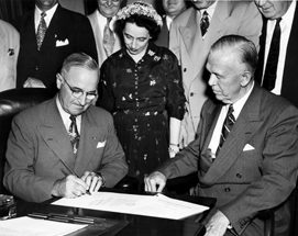 SecDef Marshall and Pres. Truman signs new draft