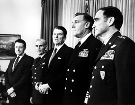 SecDef Weinberger photo with President Reagan and military service chiefs